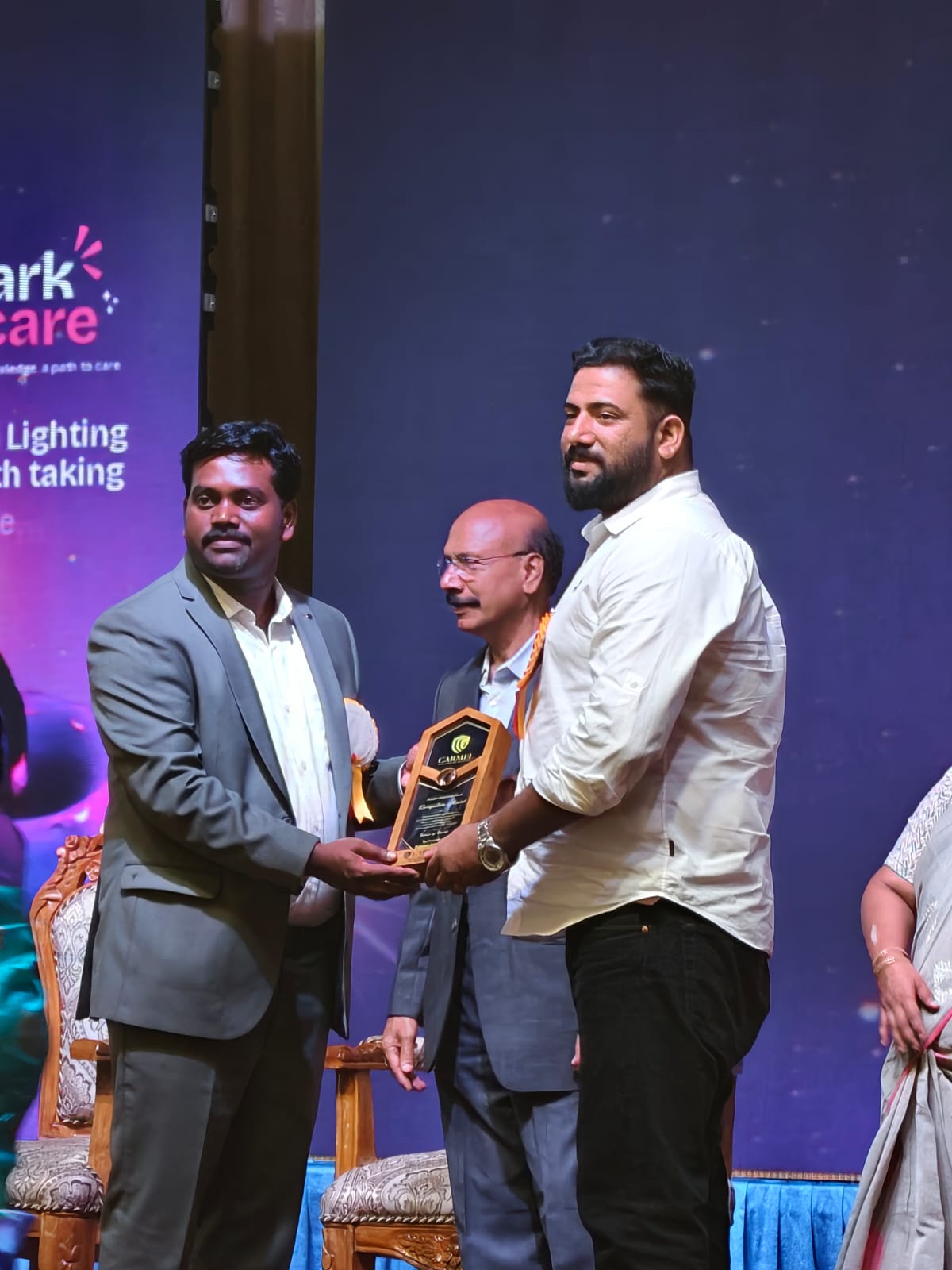 Crystal EDU Career representative receiving an achievement award on stage
