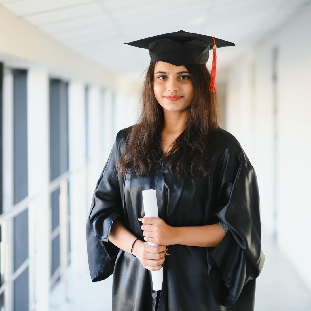 Graduate holding a diploma after completing her studies