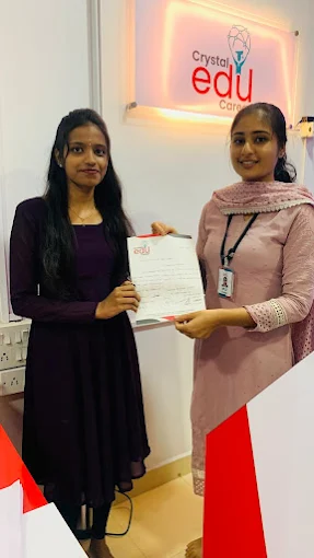 Student presenting her milestone document alongside a Crystal EDU Career team member