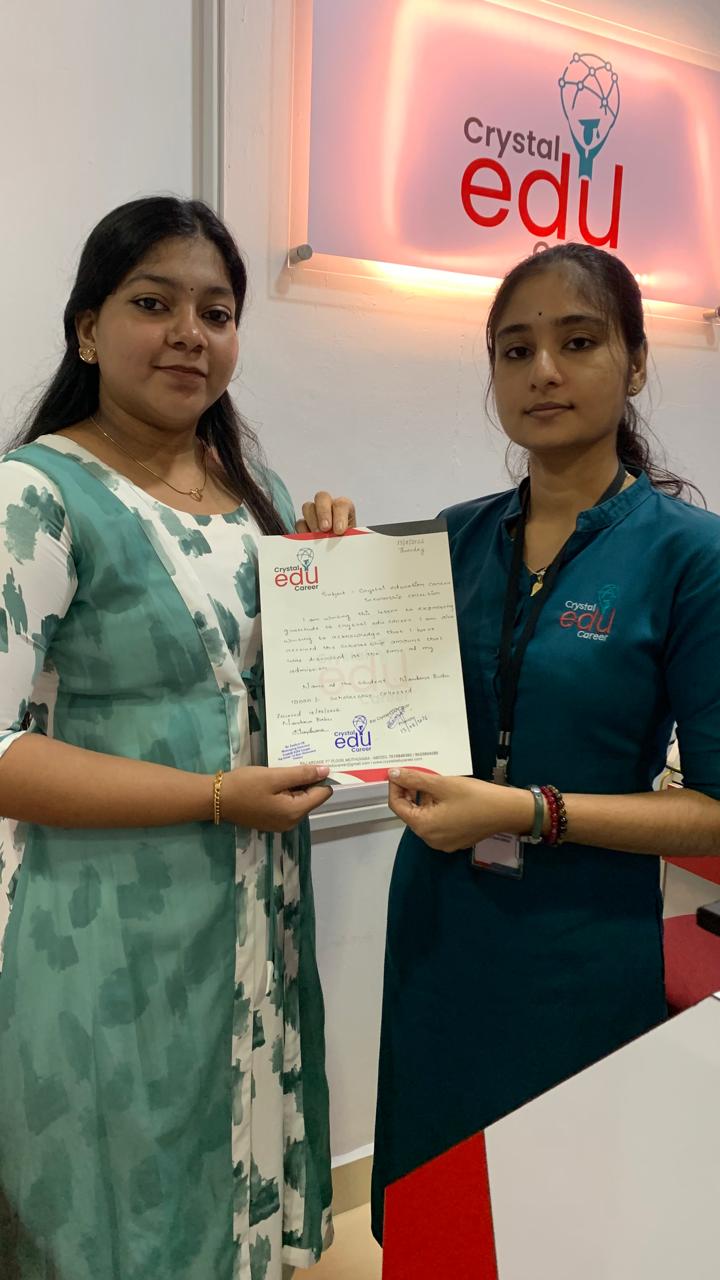 Student and Crystal EDU Career representative holding a completed milestone document
